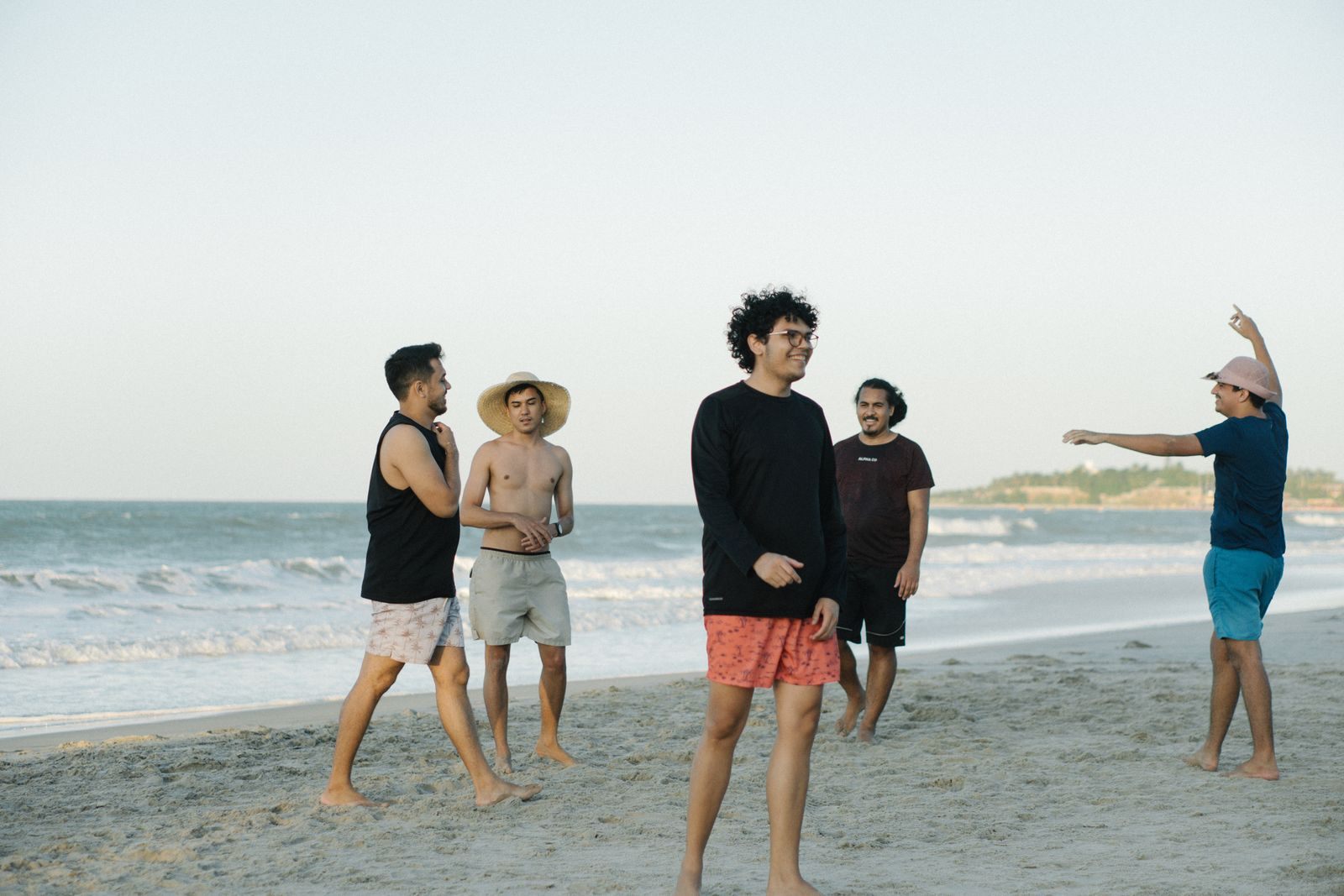 Group of young men enjoying a day on the beach together, the classic bachelor party cruise crew